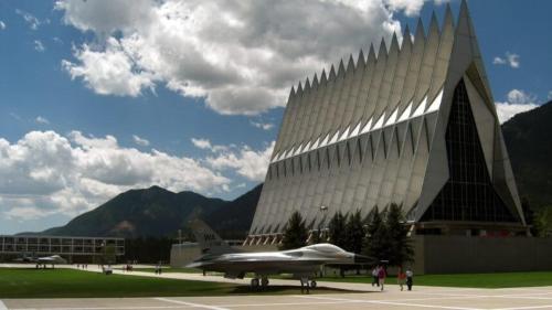a plane is parked in front of a building at Briarhaven Forest BBQ & Patio & Fast WiFi in Monument