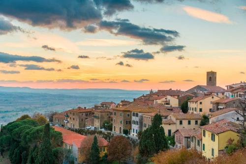 a view of a town at sunset at Ginevra Suite in Cortona