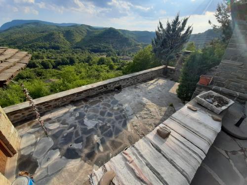 a swimming pool with a view of the mountains at Lila Traditional House in Kipoi