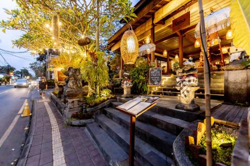 a restaurant on the side of a street at Anumana Ubud Hotel in Ubud