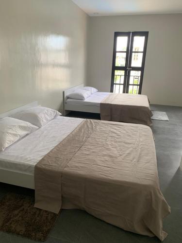 Postelja oz. postelje v sobi nastanitve Villa Beatriz Private Resort