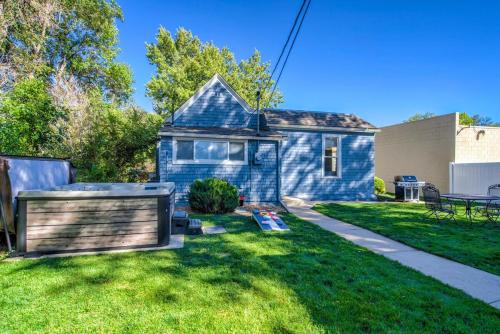 a blue house in a yard with a lawn at Corona Cabana - Hot Tub BBQ Top Attractions in Colorado Springs