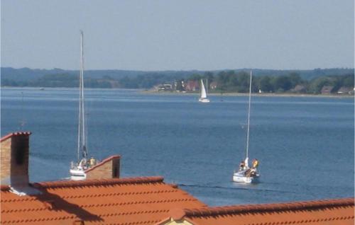 two boats floating on a large body of water at Holiday Home Marina Vej Egernsund Iv in Egernsund