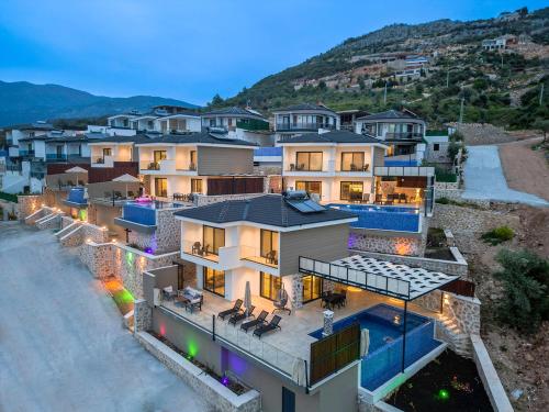 an aerial view of a house with a swimming pool at Tashan Villas in Kas