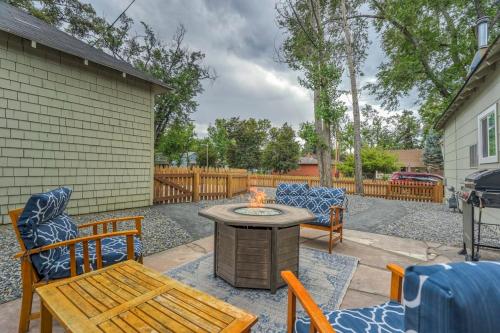 a patio with a table and chairs and a fire pit at Del Norte Cottage - Downtown King BBQ Fire Pit in Colorado Springs