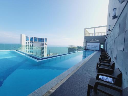 a swimming pool on the roof of a building at Elbon The Stay in Busan