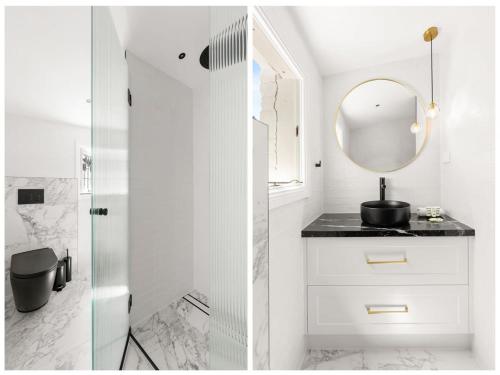 een badkamer met een wastafel en een spiegel bij Superb 3-Bed Victorian Terrace by Darling Harbour in Sydney