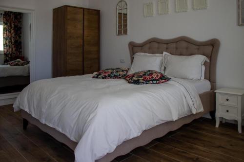 Cama o camas de una habitación en Alma Rezidence