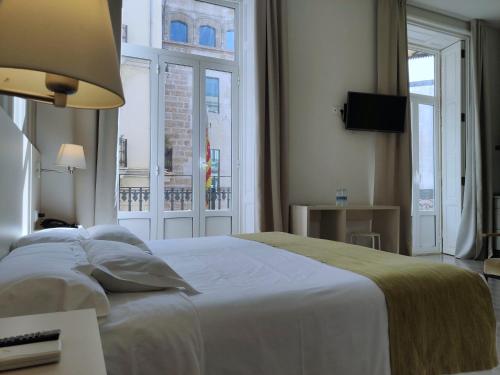 Postel nebo postele na pokoji v ubytování Hotel San Lorenzo Boutique