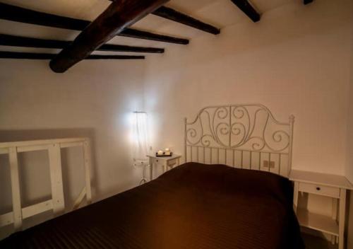 Postel nebo postele na pokoji v ubytování La Casetta Del Mare in Toscana