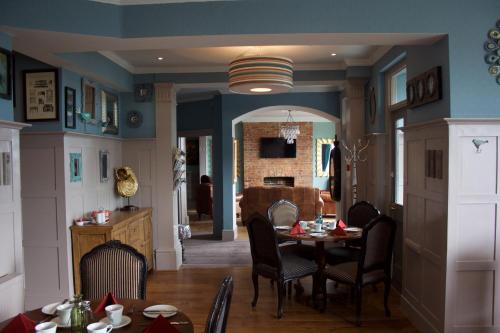 a dining room with a table and chairs at The Clyffe Hotel in Lowestoft