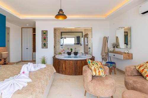a living room with a bathroom with a tub at Tashan Villas in Kas
