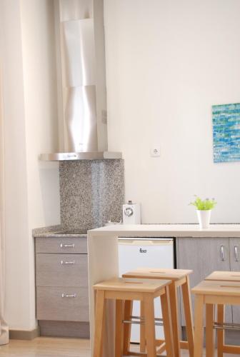 Kuchyň nebo kuchyňský kout v ubytování Hotel San Lorenzo Boutique