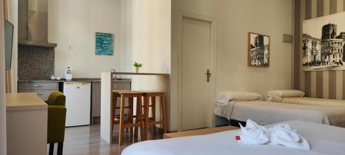Postel nebo postele na pokoji v ubytování Hotel San Lorenzo Boutique