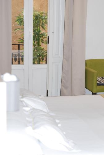 Postel nebo postele na pokoji v ubytování Hotel San Lorenzo Boutique