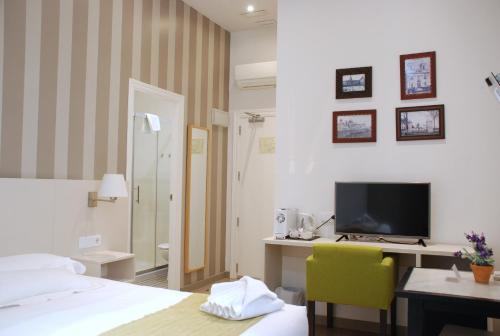Postel nebo postele na pokoji v ubytování Hotel San Lorenzo Boutique
