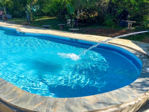 a swimming pool with a water hose at Tiret Riverside Resort and Retreat in Eldoret