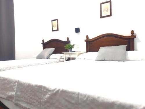 Hostal Cuzcoにあるベッド