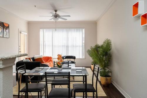a living room with a table and chairs at Stylish 1BR Farmers Branch in Farmers Branch