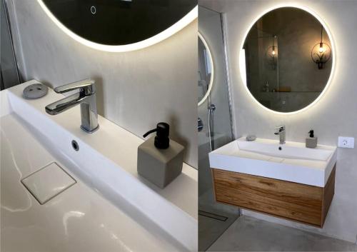 a bathroom with a sink and a mirror at Inspirational apartment - to rest & to work in Alcalá