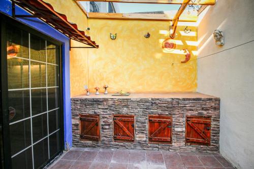 a bathroom with red doors and a sink on a wall at Wide Family or for Business House in Chihuahua in Chihuahua