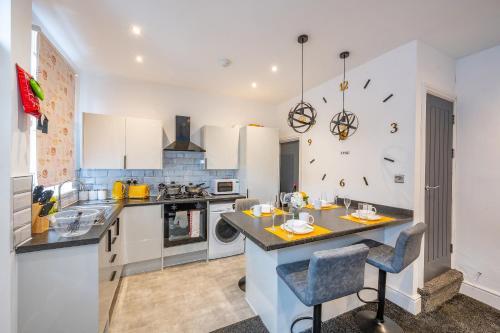 a kitchen with white cabinets and a counter top at *RB10W* For your most relaxed & Cosy stay + Free Parking + Free Fast WiFi * in Belle Isle