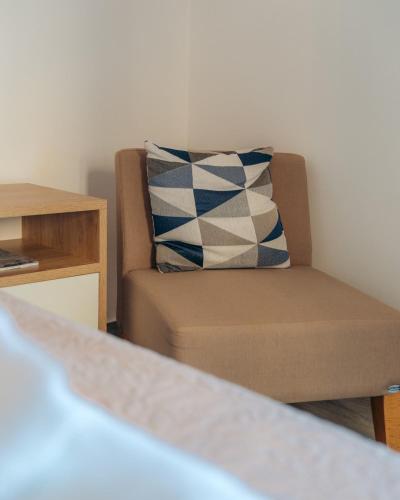 a living room with a couch and a pillow at Arhontou in Apollonia