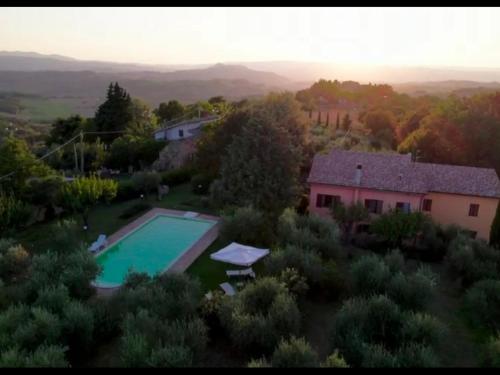 an aerial view of a house with a swimming pool at La Ginestra in Todi