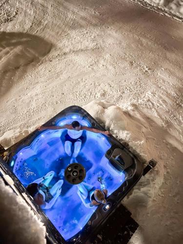 a blue object sitting in the snow with snow at Stranda Fjellgrend - with jacuzzi & 3 bedrooms in Stranda
