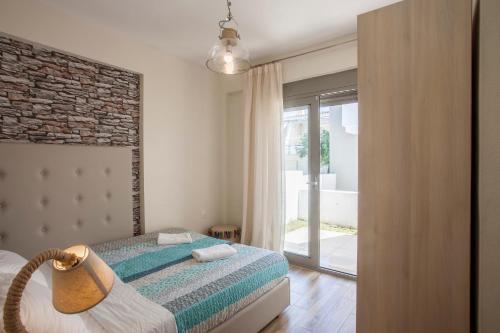 Una cama o camas en una habitación de Kassiopea home by the sea 1