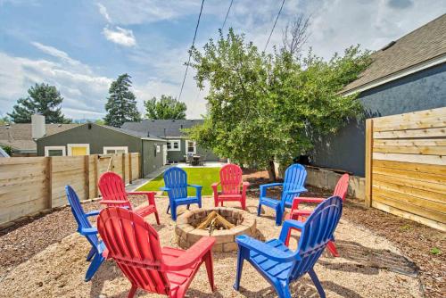 a group of colorful chairs sitting around a fire pit at Sheridan Wildflower Downtown Family Fun w Firepit in Colorado Springs