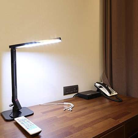 a desk with a lamp and a phone and a phone at Hotel J's in Gumi