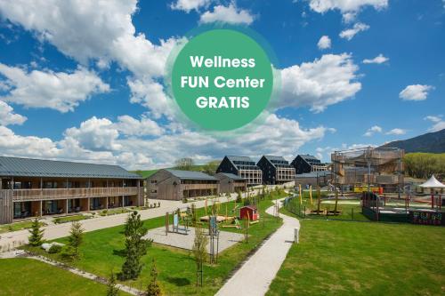 a campus with a playground with the words wellness fun center charities at Demänová Rezort in Liptovský Mikuláš