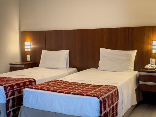 Postel nebo postele na pokoji v ubytování Hotel Cianorte Diamond