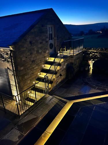 a building with a staircase with lights on it at Kiln House Lodge in Harrogate