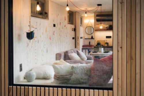 a view of a living room with a couch at Tiny House Manka in Malšín