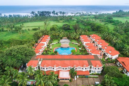 an aerial view of a resort with a swimming pool at Heritage Village Resort & Spa Goa in Cansaulim