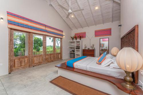 Ένα ή περισσότερα κρεβάτια σε δωμάτιο στο The Divine Villa