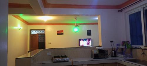 a large mirror on the wall of a room at Lovely and spacious apartment with swimming pool in Mtwapa