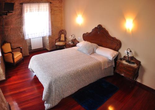 Ένα ή περισσότερα κρεβάτια σε δωμάτιο στο Casa do Tomas