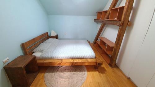 a small room with a bed and a ladder at Vojvoda in Belgrade