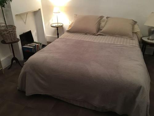 Кровать или кровати в номере Le NEW Montferrand 1 et 2