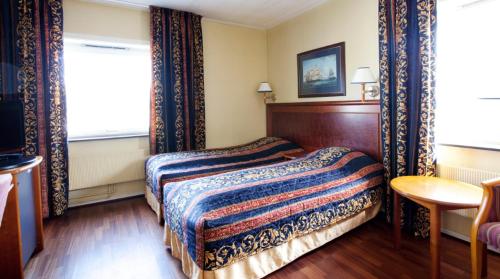 Ένα ή περισσότερα κρεβάτια σε δωμάτιο στο Quality Hotel Grand Steinkjer