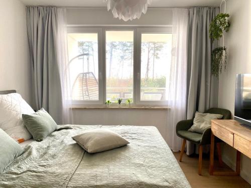 Postel nebo postele na pokoji v ubytování Ferienwohnung Dünensegler