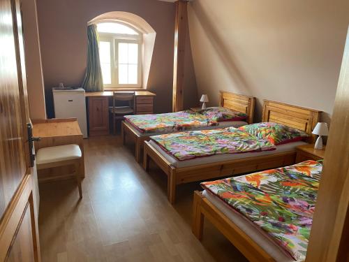 Postel nebo postele na pokoji v ubytování Ambrózia Guesthouse