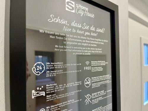 a menu for a restaurant in a window at SHOME CityHouse Graz I Self Check-in in Graz