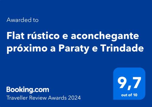 帕拉蒂的住宿－Flat rústico e aconchegante próximo a Paraty e Trindade，蓝色的标志,带有纯朴和 ⁇ 的字样