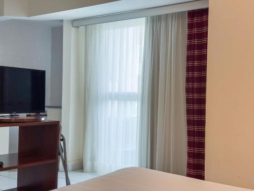 TV a/nebo společenská místnost v ubytování Hotel Cianorte Diamond
