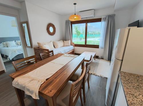 a kitchen and living room with a table and a couch at Chadel Management Cafayate in Cafayate