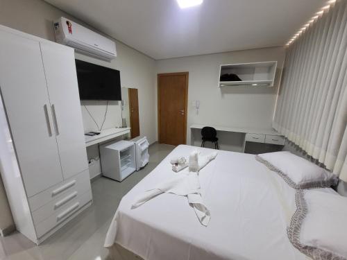 Postel nebo postele na pokoji v ubytování Hotel Avelar
